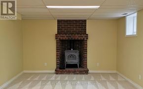 Toronto (Lansing-Westgate) apartment for rent - A room with a fireplace and a tiled floor.