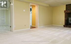 Toronto (Lansing-Westgate) apartment for rent - A room with a carpet floor and a fireplace.