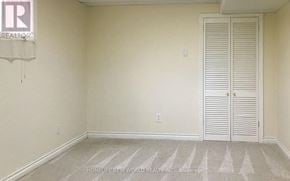 Toronto (Lansing-Westgate) apartment for rent - A room with a white door and a carpet on the floor.