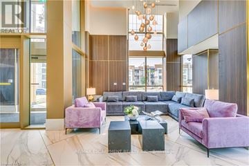 Oakville (Wm Westmount) condo for rent - A modern living room with a purple couch and a chandelier.