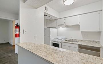 Beaumont apartment for rent - A kitchen with a countertop and cabinets.