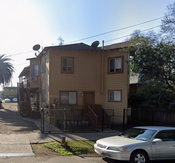 Stockton apartment for rent - A silver car is parked in front of a two-story house.