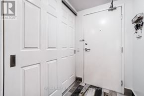 Richmond Hill (Beaver Creek Business Park) condo for rent - A white door with a handle and a small shelf on the wall.