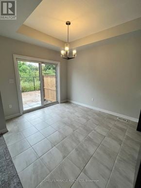 Niagara Falls (Cherrywood) townhouse for rent - A room with tile flooring and a chandelier.