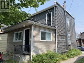 Hamilton (Crown Point) multi-family for rent - A two-story house with a balcony on the first floor.