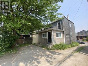 Hamilton (Crown Point) multi-family for rent - A house with a tree in front of it.