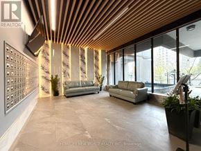 Toronto (Agincourt South-Malvern West) condo for rent - A room with wooden flooring and a glass table with a view of the city.