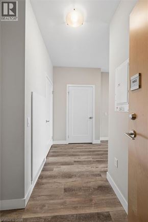 Kitchener condo for rent - A white door is on the right and a wooden door is on the left.