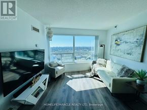 Toronto (Woburn) condo for rent - A living room with a flat screen TV and a large window overlooking the city.