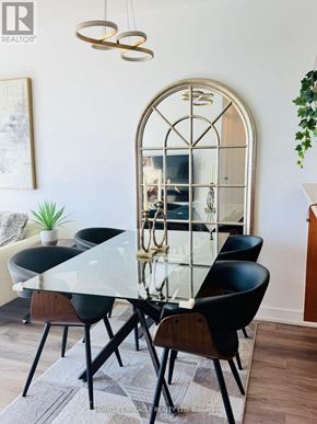 Toronto (Woburn) condo for rent - A dining room with a glass table and chairs.