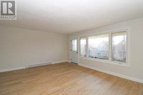 Peterborough (Town Ward 3) triplex for rent - A room with a window and a door is available for rent.