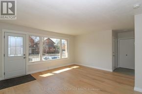 Peterborough (Town Ward 3) triplex for rent - A room with a door, a window, and a mat on the floor.
