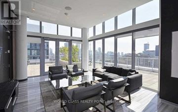 Toronto (Church-Yonge Corridor) condo for rent - A living room with black and white furniture and a view of the city.
