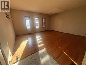 Windsor apartment for rent - A room with wooden flooring and white walls.