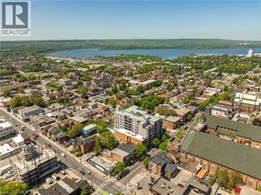Hamilton apartment for rent - A cityscape with a body of water in the distance and a clear sky.