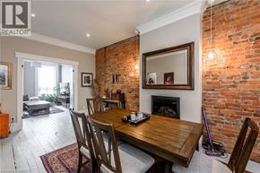 Hamilton apartment for rent - A dining room with a wooden table and chairs.