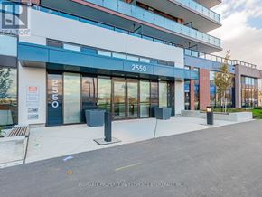 Oshawa (Windfields) condo for rent - The image shows a modern building with the number 2550 on it.