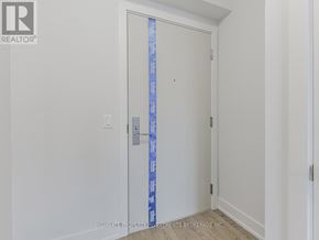 Oshawa (Windfields) condo for rent - A white door with a blue tape on the side.