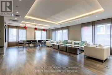 Mississauga (Churchill Meadows) condo for rent - A spacious living room with a long table and chairs.