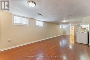 Hamilton (Berrisfield) apartment for rent - A room with wooden floors and white walls.
