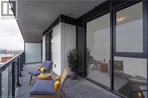 Burlington condo for rent - A balcony with a table and chairs is shown.