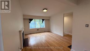 Toronto (Banbury-Don Mills) apartment for rent - A room with wooden flooring and a window with blinds.