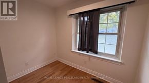 Toronto (Banbury-Don Mills) apartment for rent - A room with a window and wooden flooring.