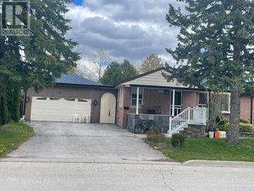 Richmond Hill (Crosby) apartment for rent - A house with a sign that says REALTOR in front of it.
