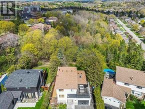 Caledon (Bolton West) apartment for rent - A bird's eye view of a residential area with houses and trees.