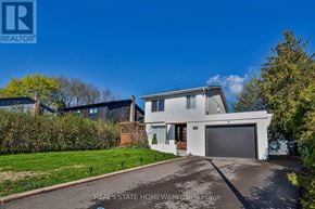 Caledon (Bolton West) apartment for rent - A modern house with a white garage door is for sale.