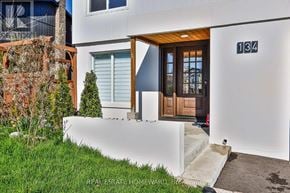 Caledon (Bolton West) apartment for rent - A modern house with a white exterior and a brown door.