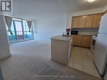 Toronto (Bendale) condo for rent - A kitchen with a refrigerator, microwave, and oven.