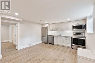 London North (North I) apartment for rent - A kitchen with white cabinets and stainless steel appliances.