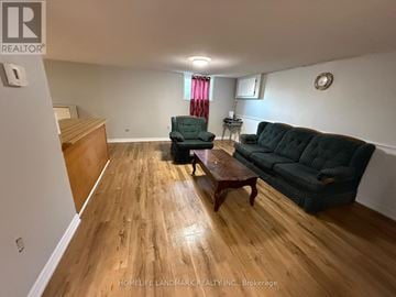 Kawartha Lakes (Lindsay) apartment for rent - A living room with a couch, chair, and coffee table.