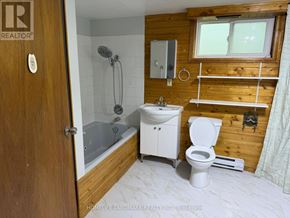 Kawartha Lakes (Lindsay) apartment for rent - A bathroom with a toilet, sink, and shower.