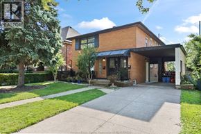 Windsor apartment for rent - A house with a brick facade and a black awning is for sale.