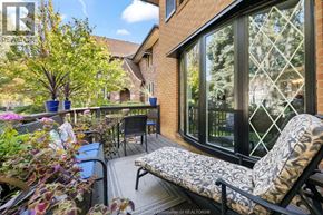 Windsor apartment for rent - A patio with a couch, chairs, and a table with a potted plant on it.