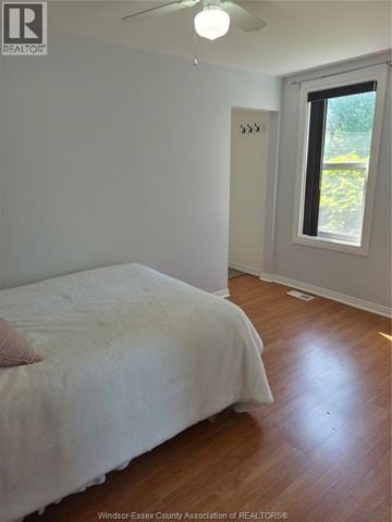 Windsor apartment for rent - A bedroom with a bed and a window.