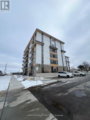 Waterloo condo for rent - A building with the text HOMELIFE/MIRACLE REALTY LTD. Brokerage on the side of it.