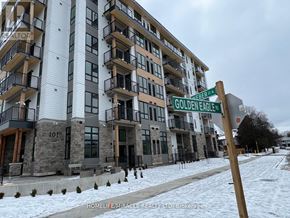 Waterloo condo for rent - A street sign for Golden Eagle Street stands in front of a large apartment building.