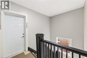 Hamilton apartment for rent - A room with a white door and a window with a black railing.