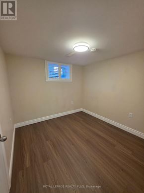 Hamilton (Inch Park) apartment for rent - A small, clean kitchen with white appliances and wooden floors.