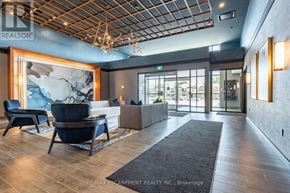 Hamilton (Waterdown) condo for rent - A waiting area with a large map on the wall and comfortable seating.