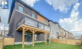 Newmarket (Woodland Hill) apartment for rent - A modern house with a wooden deck in front.