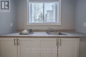 Pickering (Liverpool) apartment for rent - A kitchen with a sink and a window.