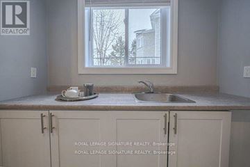 Pickering (Liverpool) apartment for rent - A kitchen with a sink and a window.