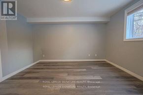 Pickering (Liverpool) apartment for rent - A room with wooden flooring and a window on the right side.