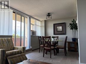 Mississauga (Meadowvale) condo for rent - A dining room with a table set for two and a view of the outside.