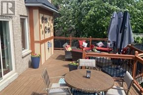 Burlington (Alton) apartment for rent - A patio with a table and chairs and a couch.
