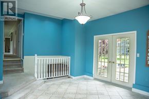 Mulmur apartment for rent - A room with blue walls and a white crib.